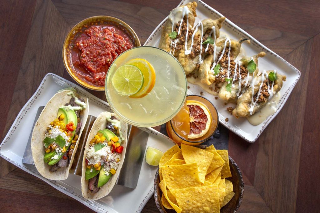 Selection of tacos, appetizers, chips, and cocktails representing the best restaurants in St. Augustine, Florida.